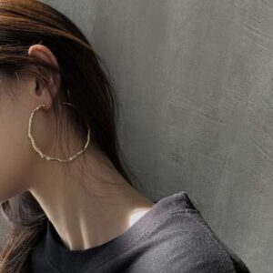 Bold irregular-shaped gold hoop earrings for a statement look - Shop now