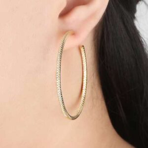 Handcrafted gold hoop earrings exuding dazzling brilliance - Shop now"