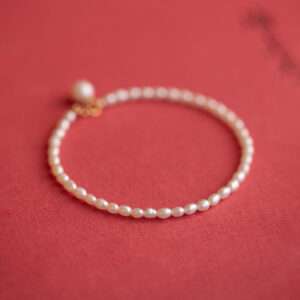 A freshwater small pearl bracelet on a white background