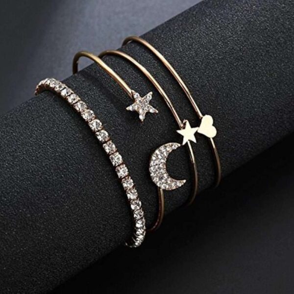 Heart Star Moon Charm Bracelet for Women and Girls - Delicate and Meaningful Jewelry on a model's wrist