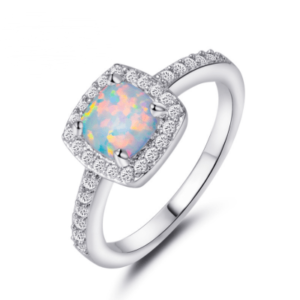 Close-up of Opal Ring with Shimmering Stones on White Background